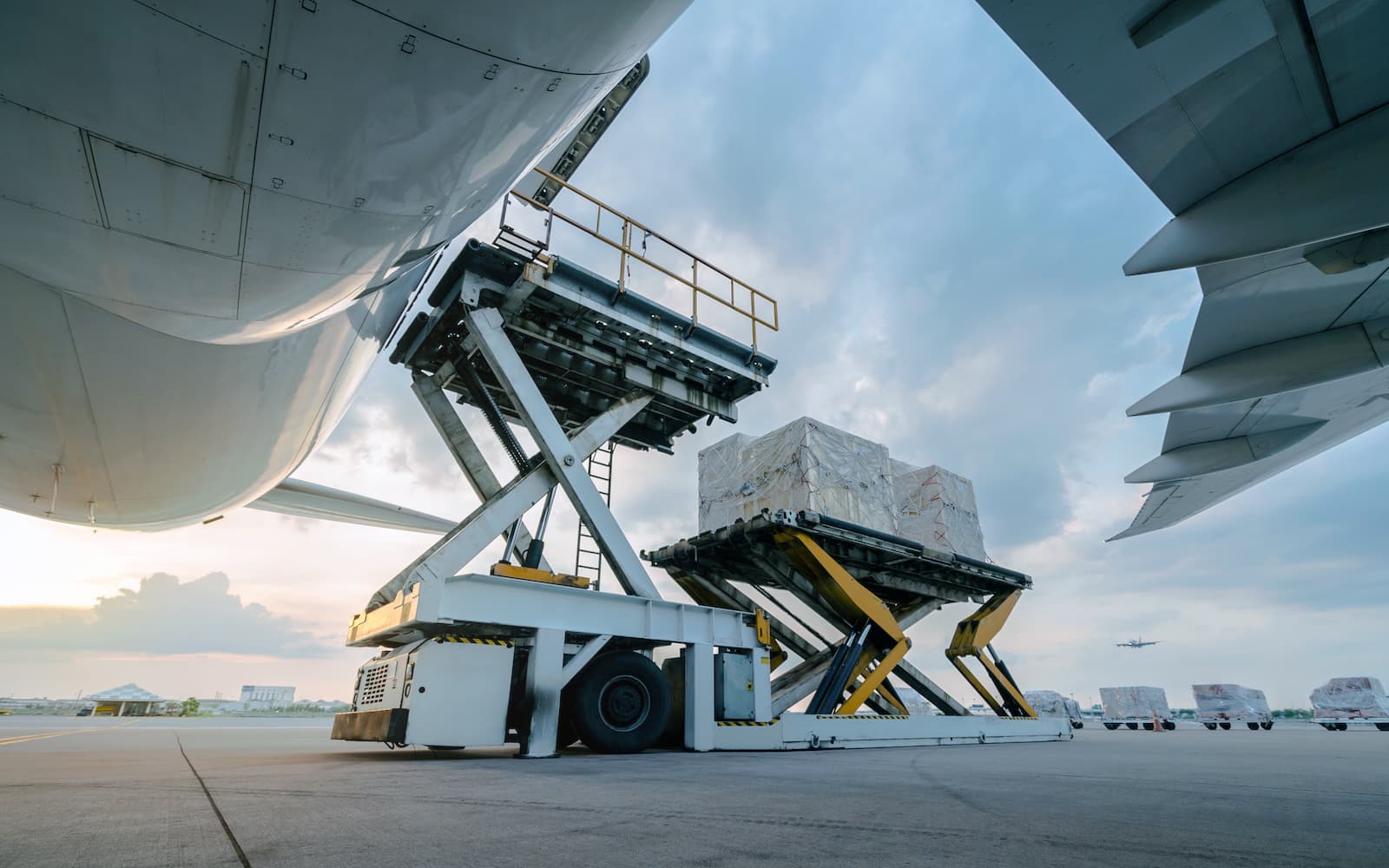 Analgesic product being loaded onto freight plane for relocation